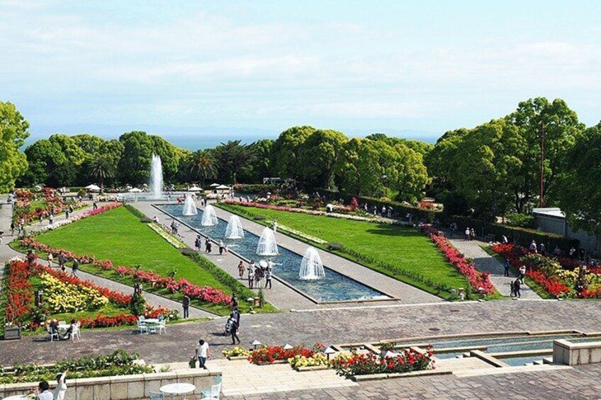 A park with fountains, flower beds, and walking paths. 2