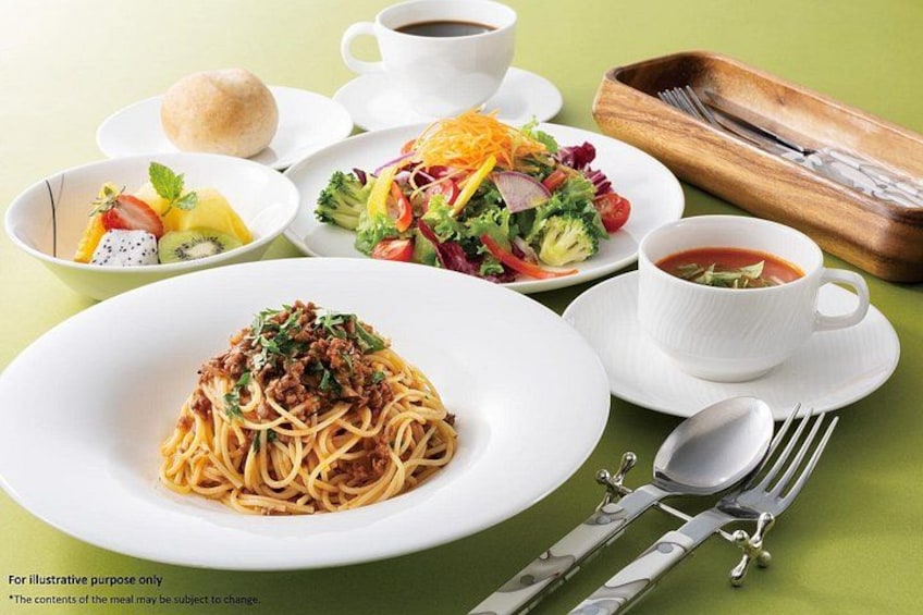 A meal with spaghetti, salad, soup, and bread on a table. 4