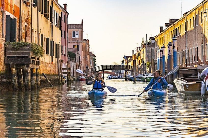 A canal with boats and buildings. 3