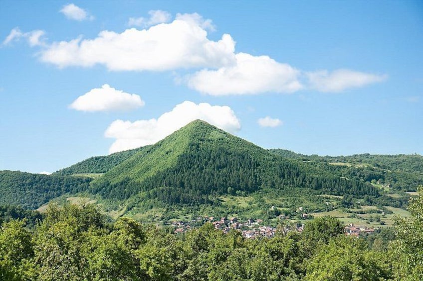 A mountain with a village at its base. 1