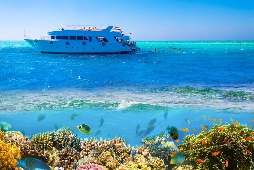 A white boat on turquoise water with clear skies. 5