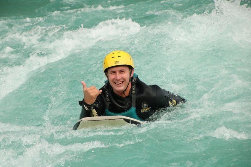A person in a kayak on a river. 3