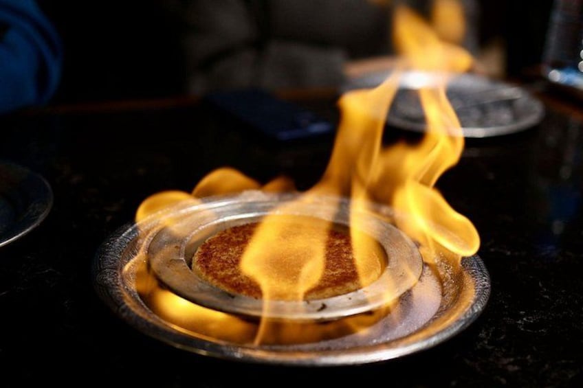 A close-up of a flame on a stove. 5