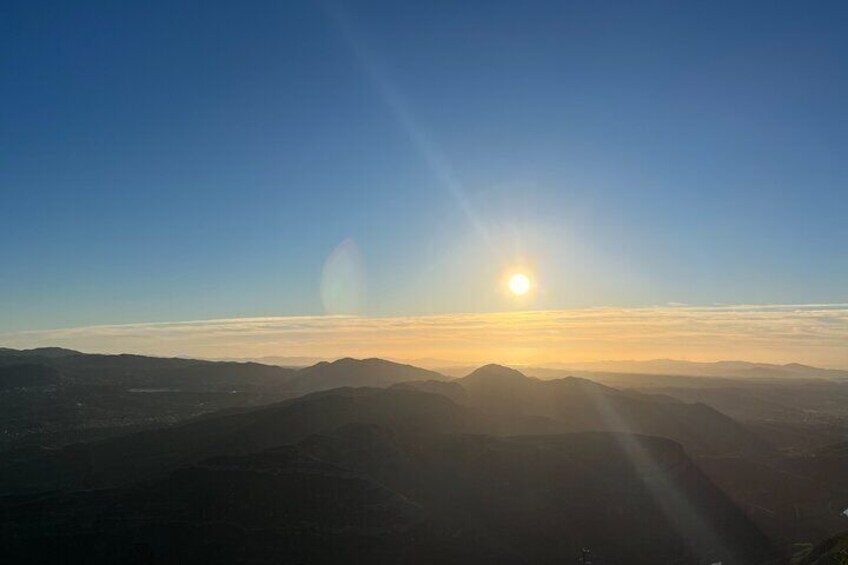 A sunrise over a mountainous landscape. 5