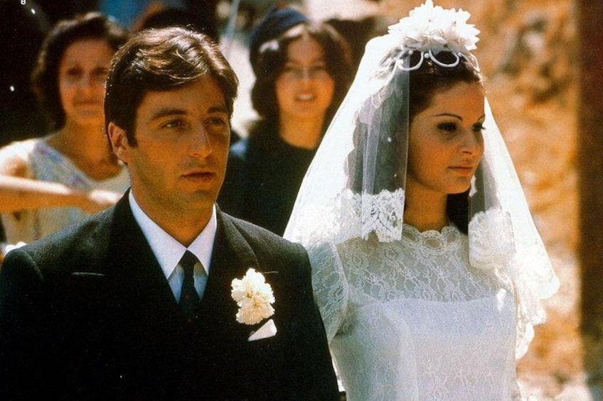 A bride and groom in wedding attire. 1