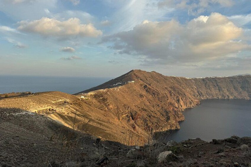 A rugged mountain landscape with a body of water at its base. 5