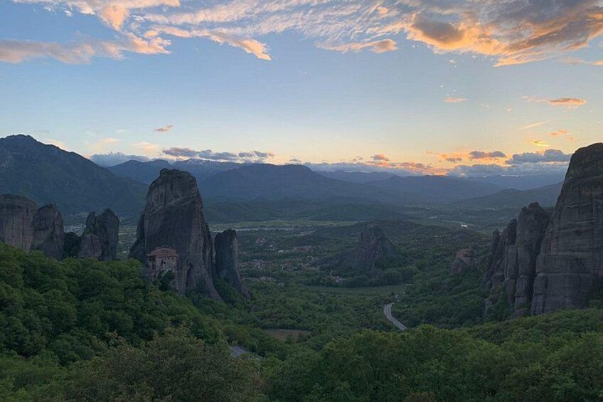 A mountainous landscape with prominent rock formations and a winding road. 5