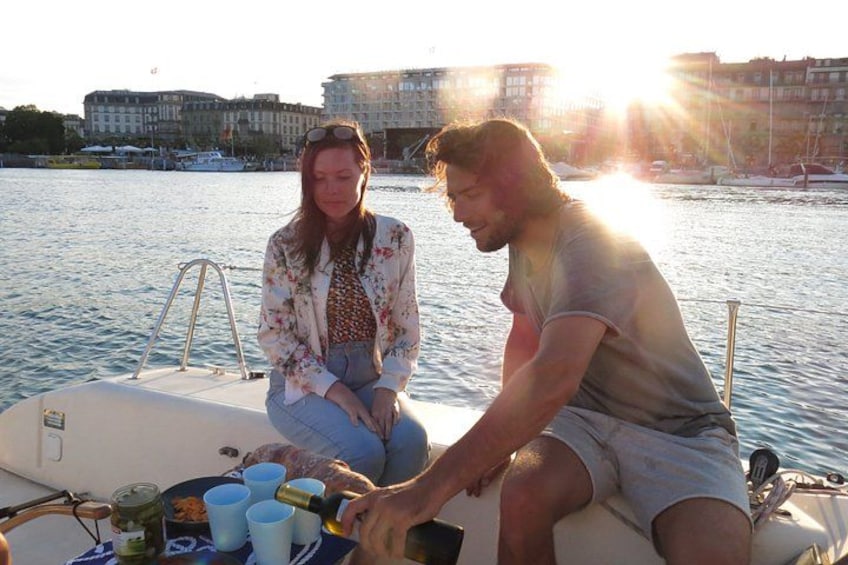 Two people on a boat with a cityscape in the background. 3
