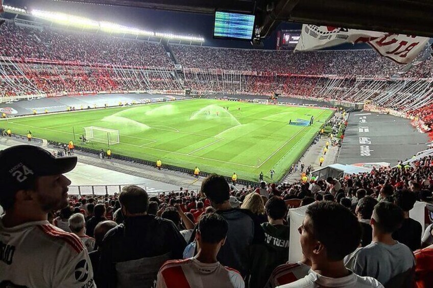 A football stadium filled with spectators. 3