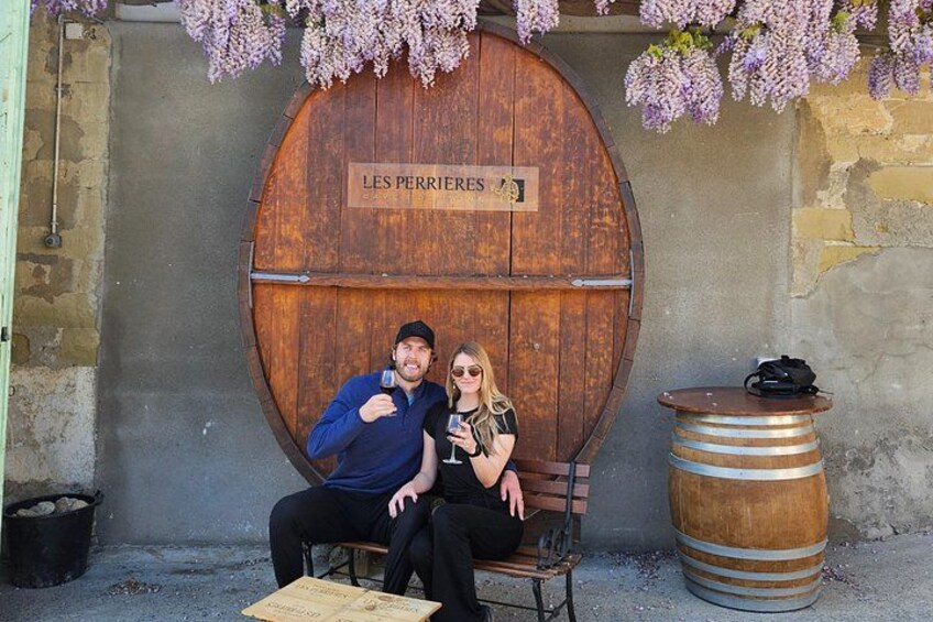 A wooden barrel, a bench, and a sign that reads 'LES PERRIERES.' 5