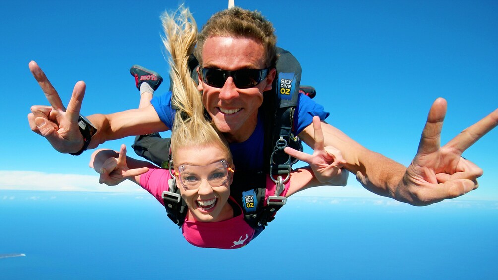 Tandem skydivers free falling over Batemans Bay