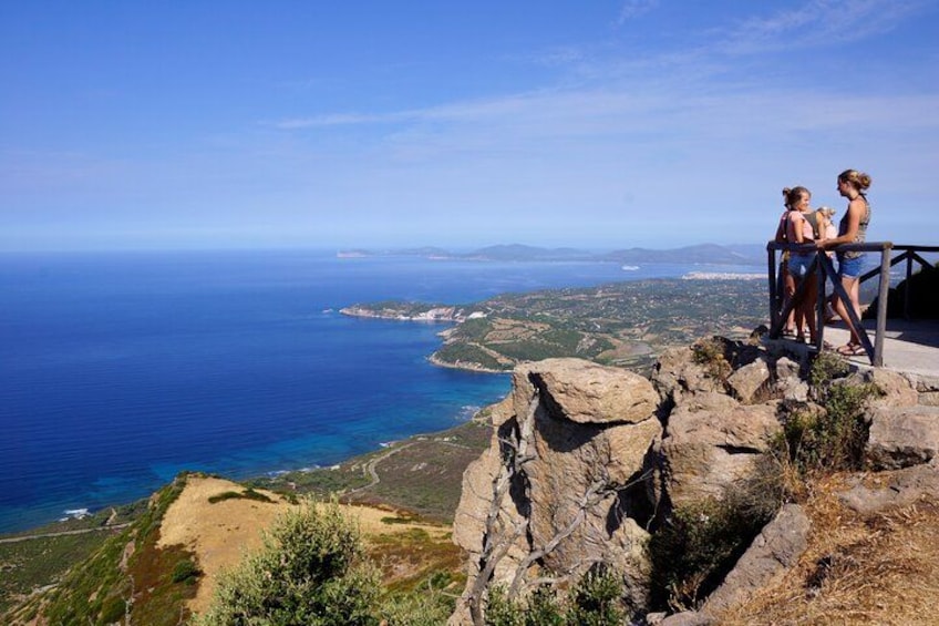 A coastal landscape with rocky terrain and a view of the sea. 1