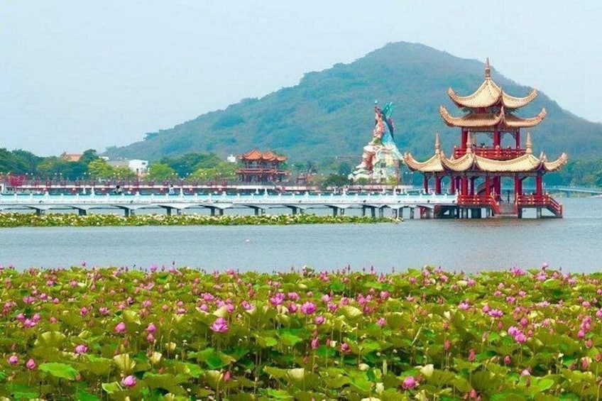 A lotus pond, a pagoda, and a mountain in the background. 4