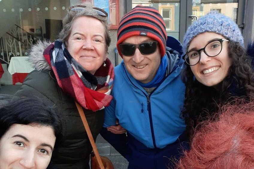 A group of people outdoors, wearing winter clothing. 4