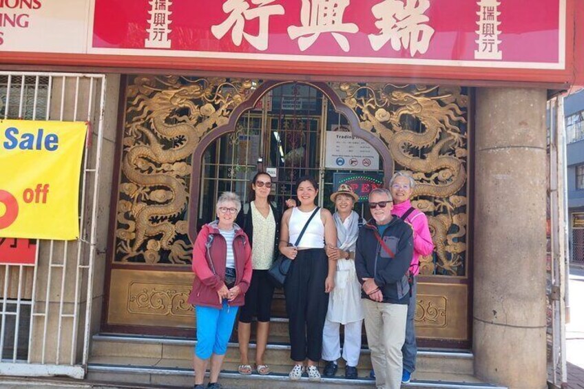 In front of an 80-year old Chinese supermarket. 