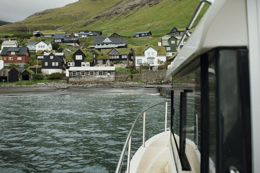 A coastal village with houses by the water. 4