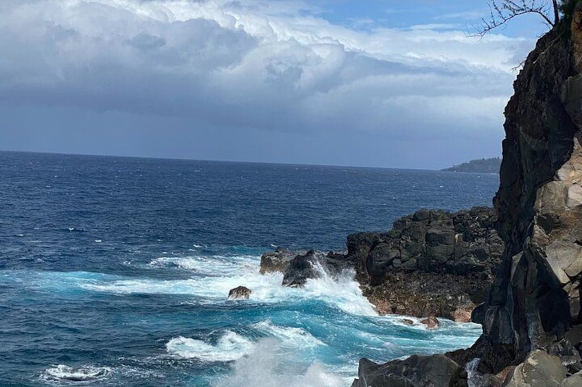 A rocky coastline with waves crashing against the rocks. 1