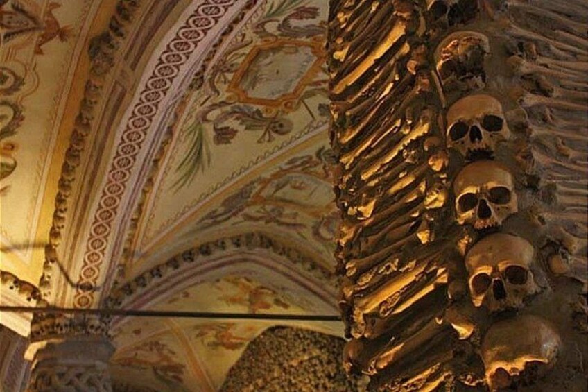A ceiling with intricate patterns and skulls. 4