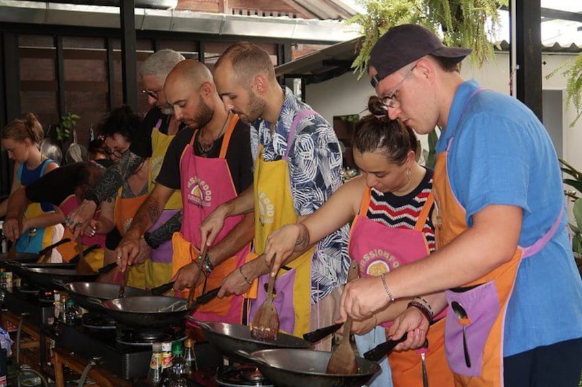 People cooking in a kitchen. 1