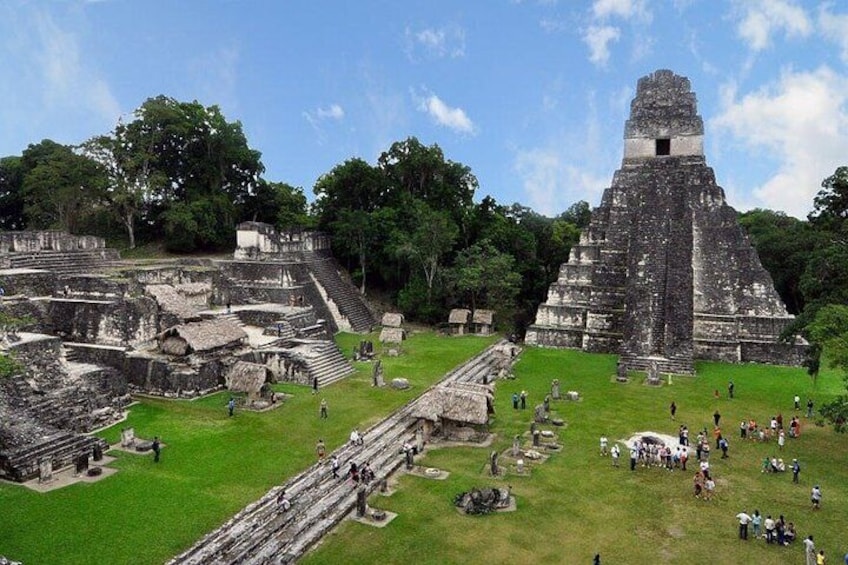 Ancient ruins with a large pyramid and stepped structures. 3