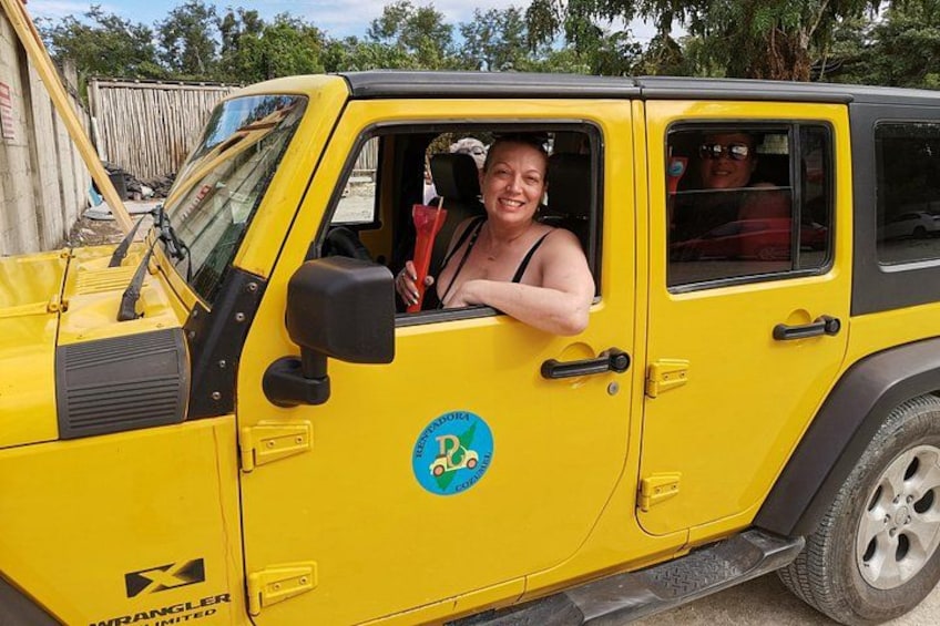 A yellow off-road vehicle with a sticker on the side. 5