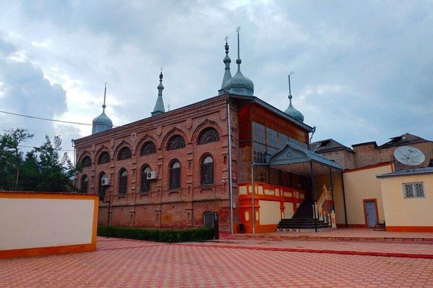 A historic building with multiple domes and a clock tower. 5