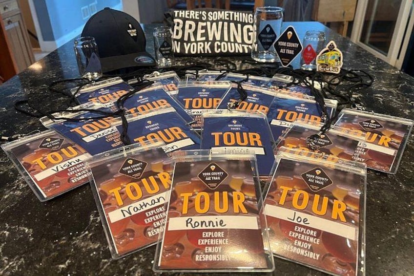 A table with tour tickets and promotional items. 3