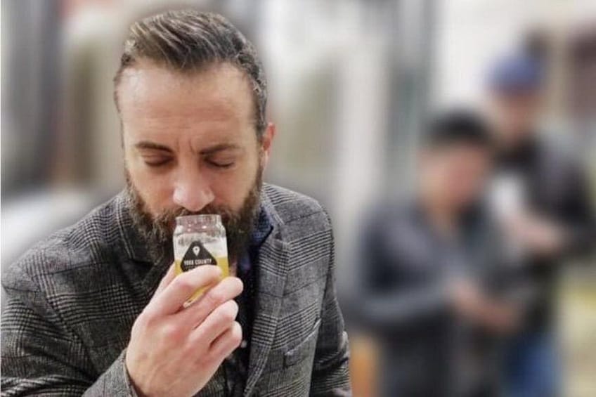 A person holding a small object. 5