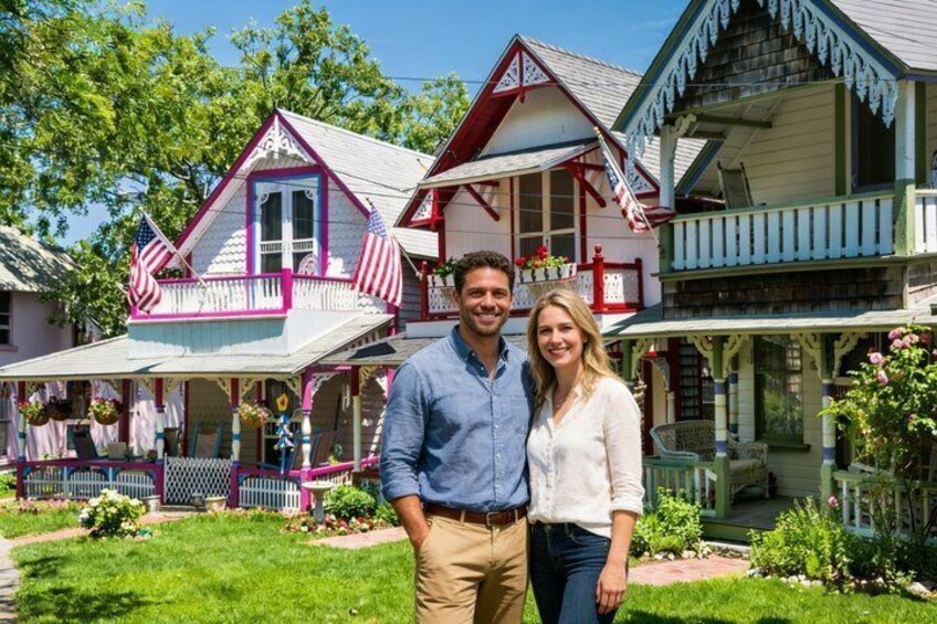 A house with a porch, a flag, and a garden. 2