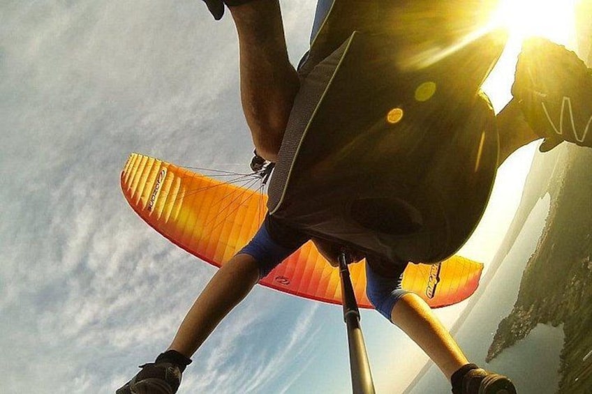 A person with a parachute harness and a parachute. 2