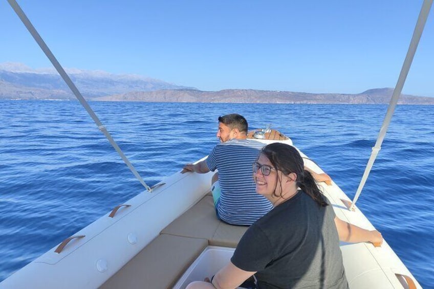 A boat on the water with a mountainous landscape in the background. 5