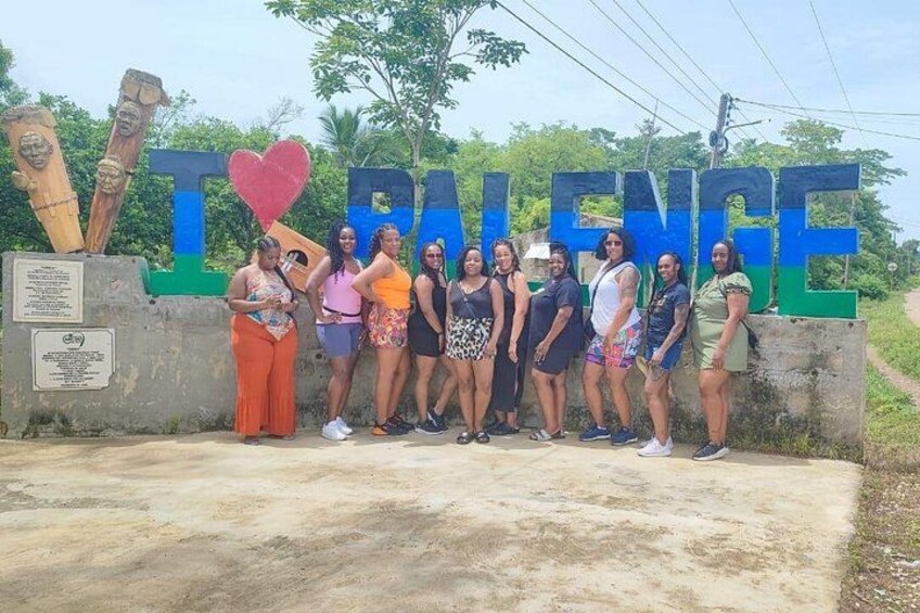 A group of people standing in front of a sign that reads 'I ♥ BALANCE.' 5