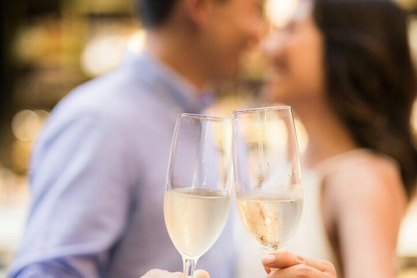 Two people holding champagne glasses. 4