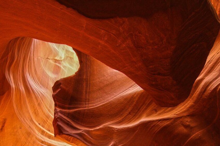 A canyon with red sandstone walls and a narrow opening. 1