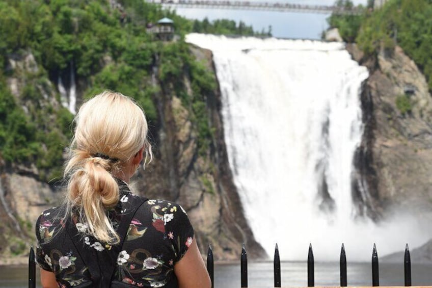 A waterfall with a person in the foreground. 5