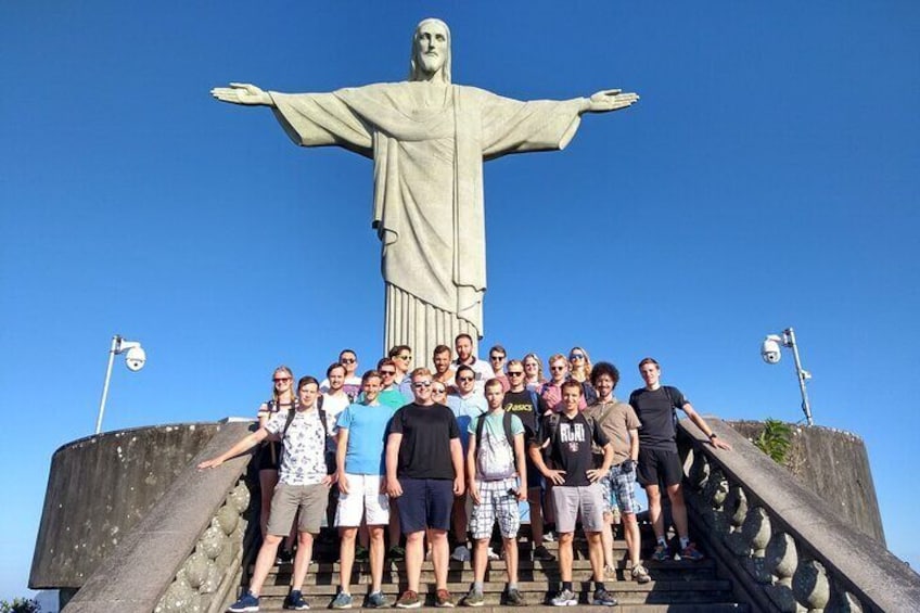 Iconic Landmark: Captured from a distance, this photo showcases the Christ the Redeemer statue as an iconic landmark of Rio de Janeiro.