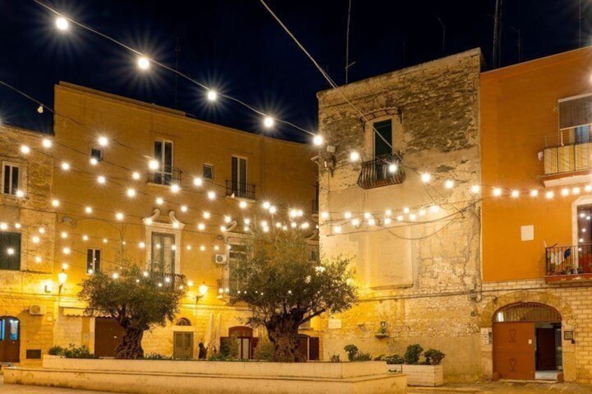 A building with string lights and trees. 3