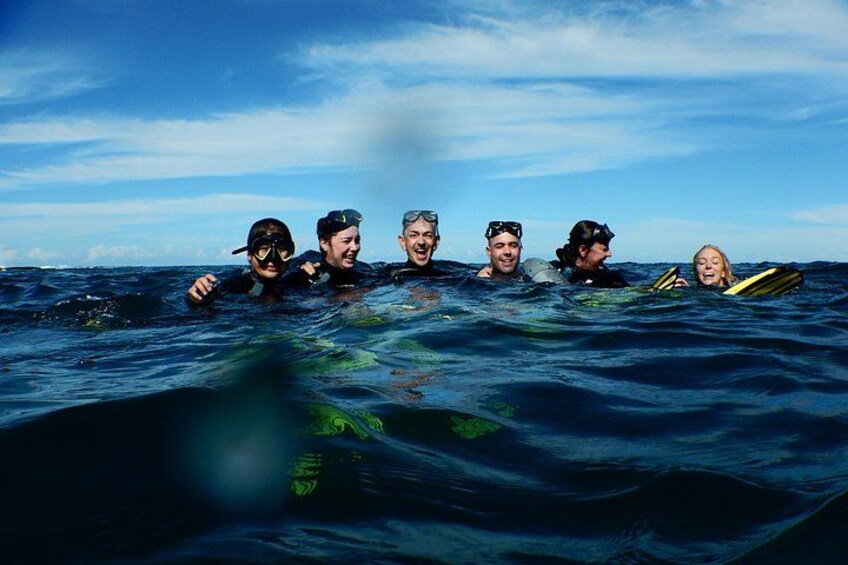 A group of people snorkeling in the ocean. 2