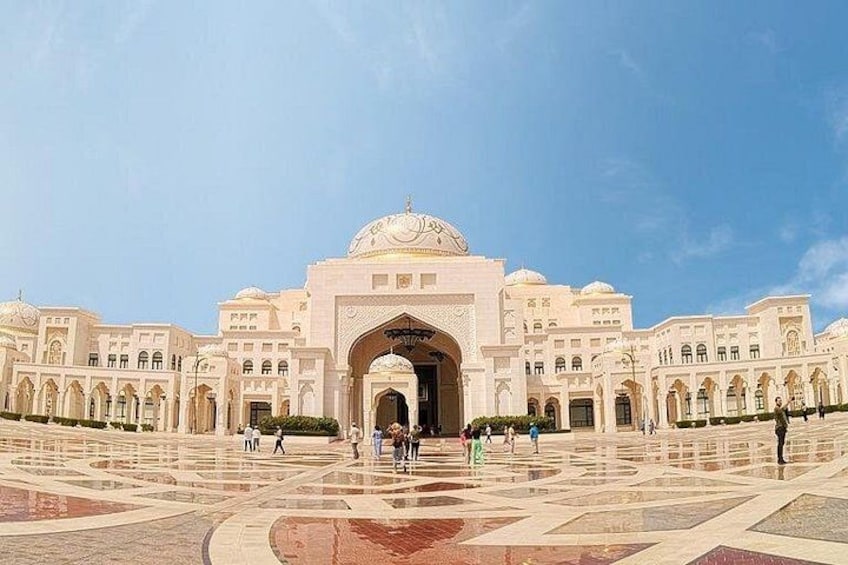 A large, ornate building with a central dome and multiple arches. 5