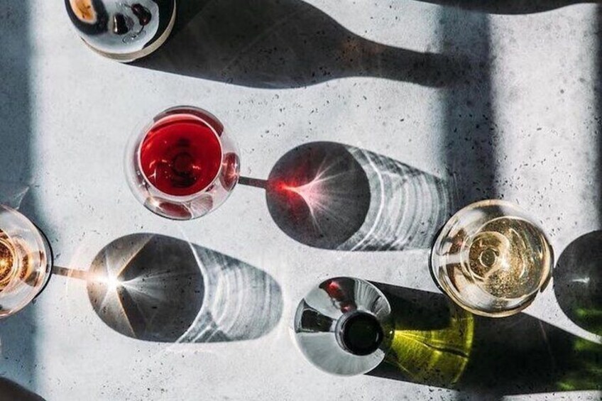 A top-down view of several wine glasses on a table. 5