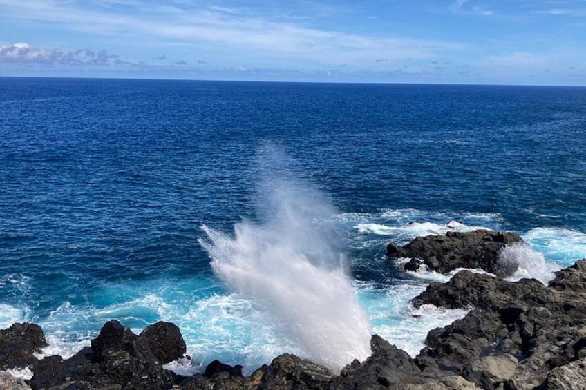 A rocky coastline with waves crashing against the rocks. 2