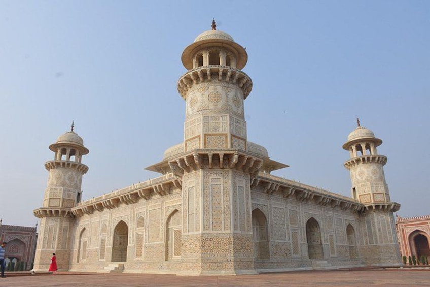 A large, ornate building with multiple domes and minarets, featuring intricate architectural details. 2