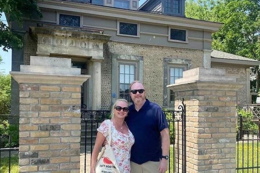 A house with a stone facade, a metal gate, and a brick entrance. 2
