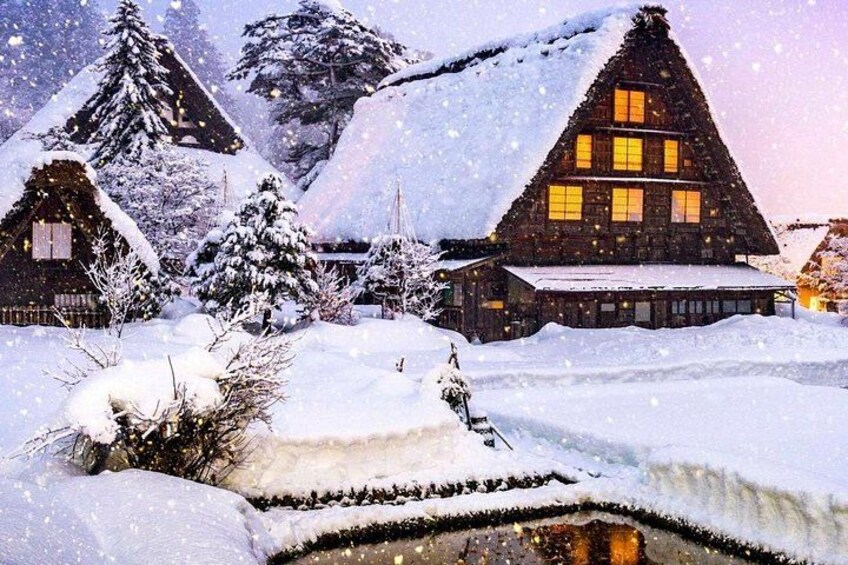 A snowy village with wooden houses and snow-covered trees. 5