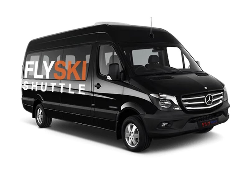 A black Mercedes van with 'FLYSKI SHUTTLE' written on the side. 1