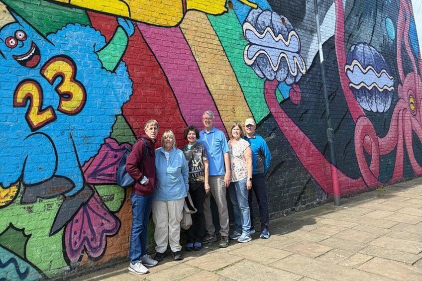 A colorful mural with cartoonish figures and the number 23. 4