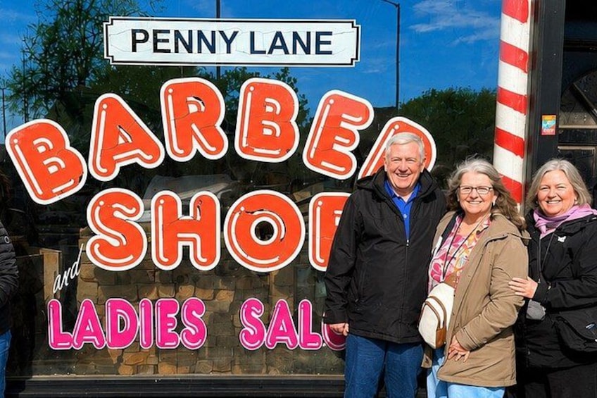 A sign for Penny Lane Barbershop and Ladies Saloon. 3
