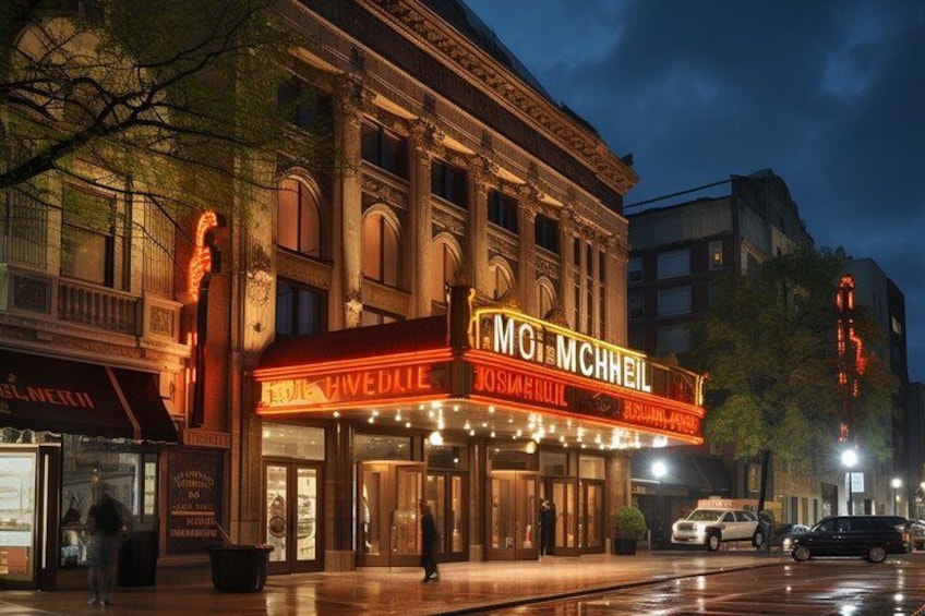 A theater marquee with 'MO MCHHEIL' and 'WEDNESDAY' illuminated. 5