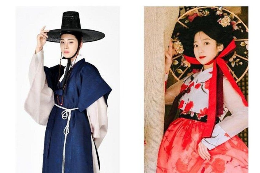 A person in traditional attire with a wide-brimmed hat and a red skirt. 2