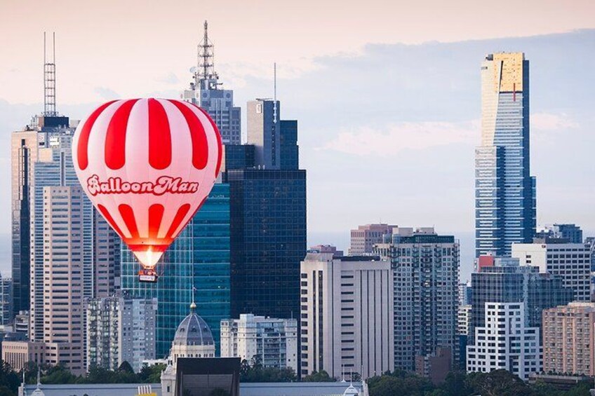 A city skyline with a hot air balloon labeled 'Balloon Man' in the foreground. 2